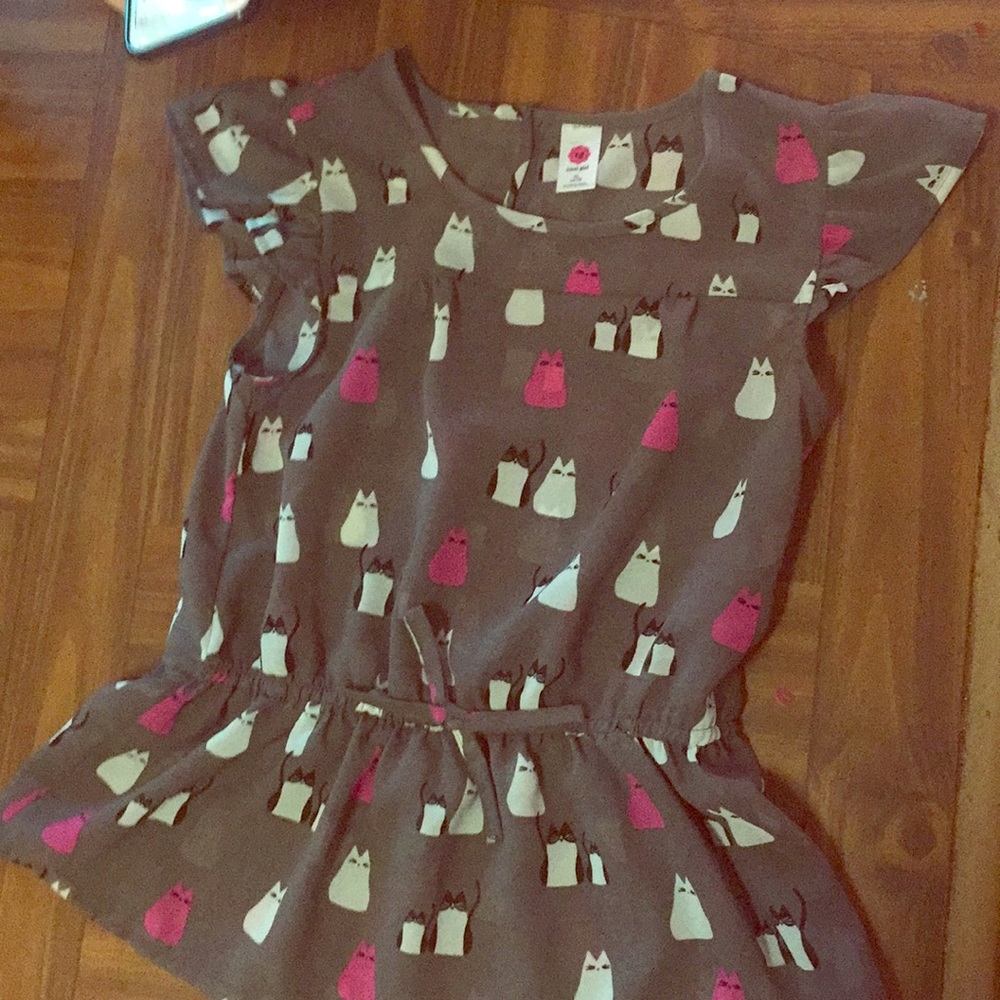 A blouse with cats
